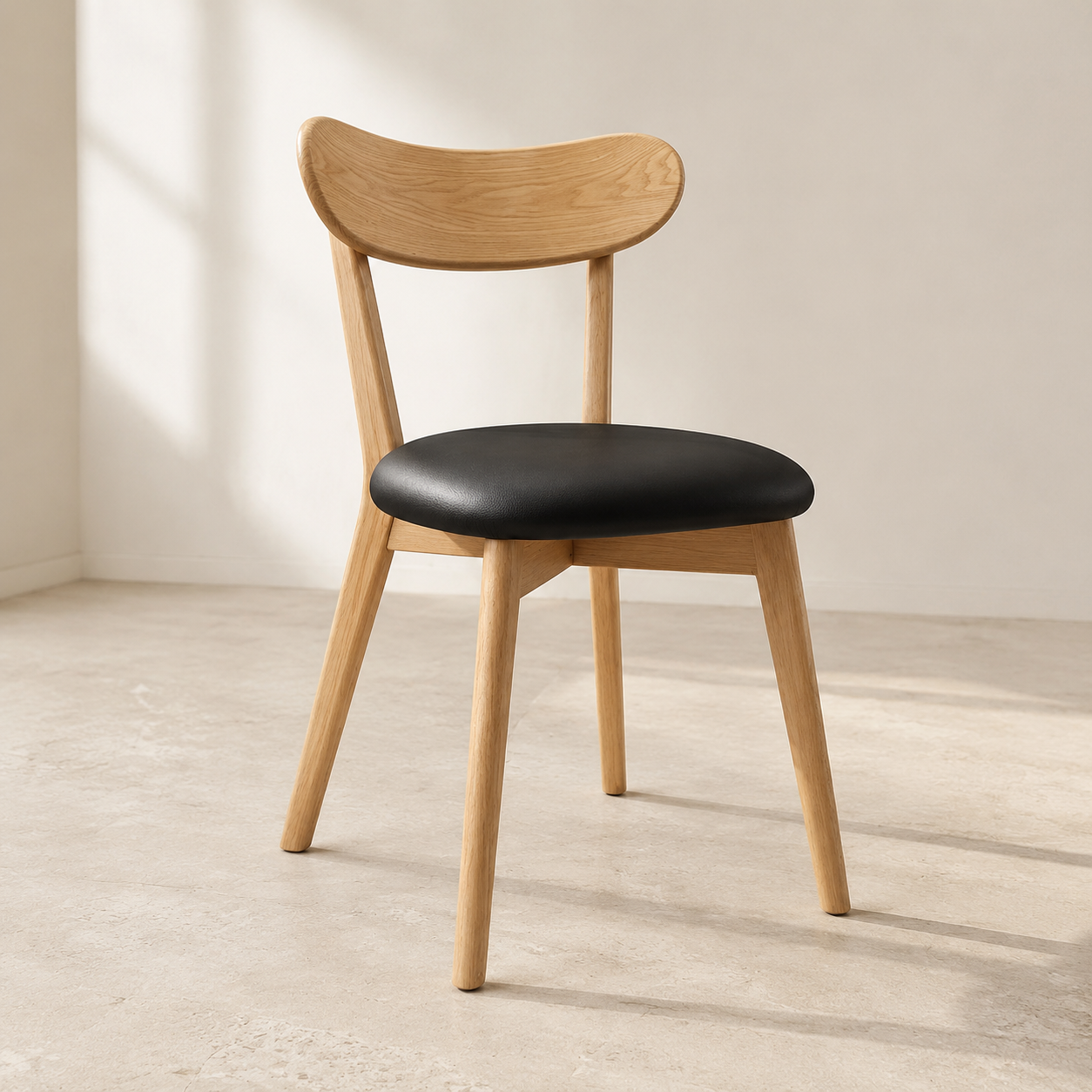 Mireva solid wood dining chair in natural oak and black, front view